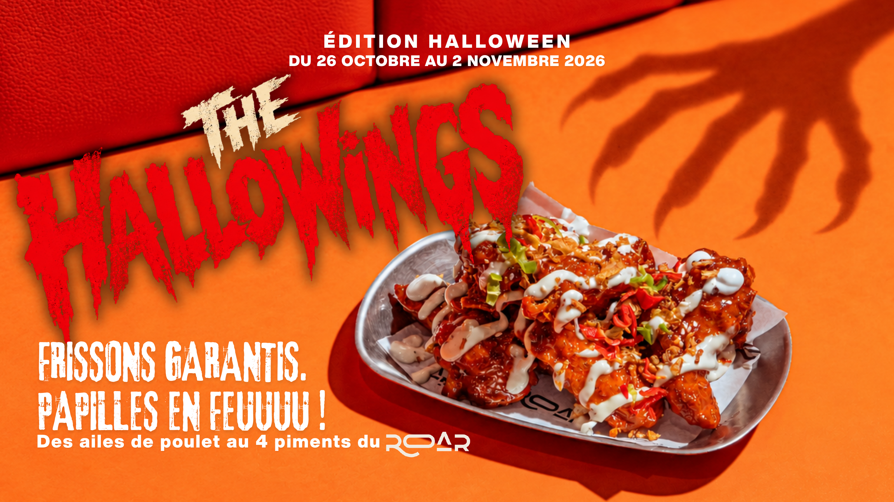 Bannière The Hallowings : wings aux quatre piments sur un plateau, ombre de main de monstre et lettrage rouge et crème sur fond orange.